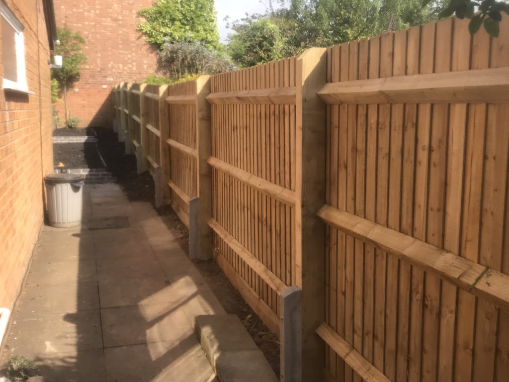 Godfather posts fixed to existing fencing